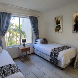 Laguna la Crete 70 - A self-catering place to stay in Uvongo on the South Coast KZN with a swimming pool, tennis courts, air conditioner, dstv and 24 hour security.