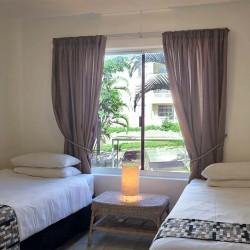 Laguna la Crete 70 - A self-catering place to stay in Uvongo on the South Coast KZN with a swimming pool, tennis courts, air conditioner, dstv and 24 hour security.