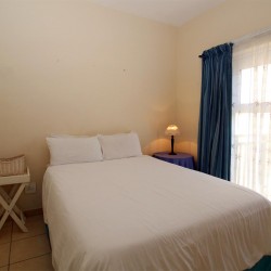 On the Margate seafront South Coast of KZN is Balooga 8. A 7 sleeper lovely seaviews - 2nd Bedroom - Happy Holiday Homes