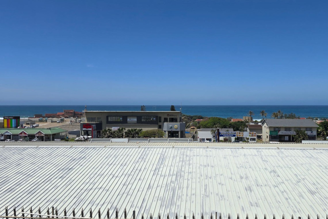 Enjoy an air-conditioned holiday close to Shelly Centre and MacDonalds at Isles of Shelly 8 a 5 sleeper simplex in Shelly Beach with sea views, WIFI internet, a charcoal braai, and all the comforts of home.