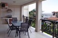 Kubu Bali 18, a 7-sleeper self-catering holiday flat in Shelly Beach with sea views, a spacious patio with gas braai, and beachfront access.