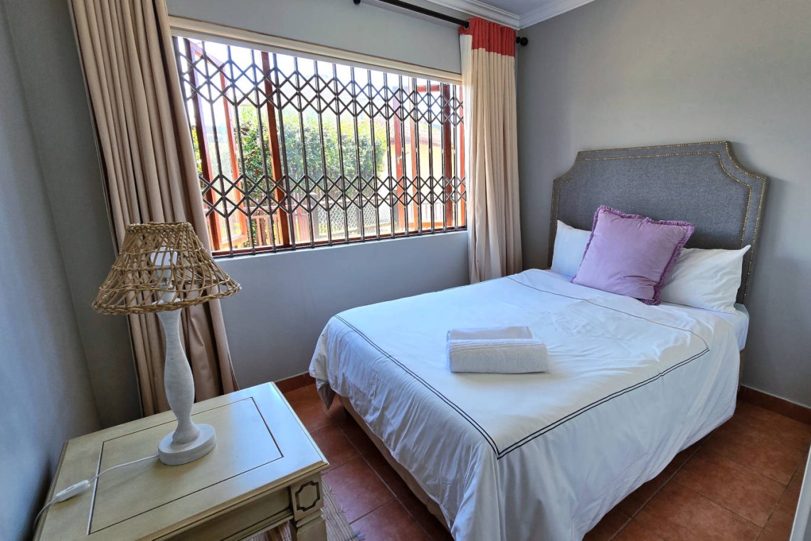 Stay at Kuta Beach 17 Ramsgate, a stunning 4-bedroom, 8-sleeper self-catering holiday apartment KZN with sea views, Wi-Fi, pool, and Smart TV.