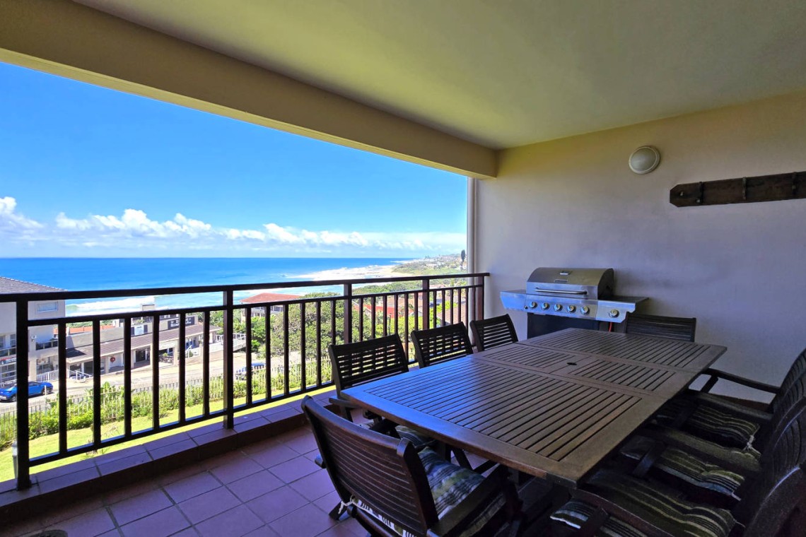 Stay at Kuta Beach 17 Ramsgate, a stunning 4-bedroom, 8-sleeper self-catering holiday apartment KZN with sea views, Wi-Fi, pool, and Smart TV.