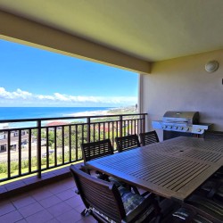 Stay at Kuta Beach 17 Ramsgate, a stunning 4-bedroom, 8-sleeper self-catering holiday apartment KZN with sea views, Wi-Fi, pool, and Smart TV.