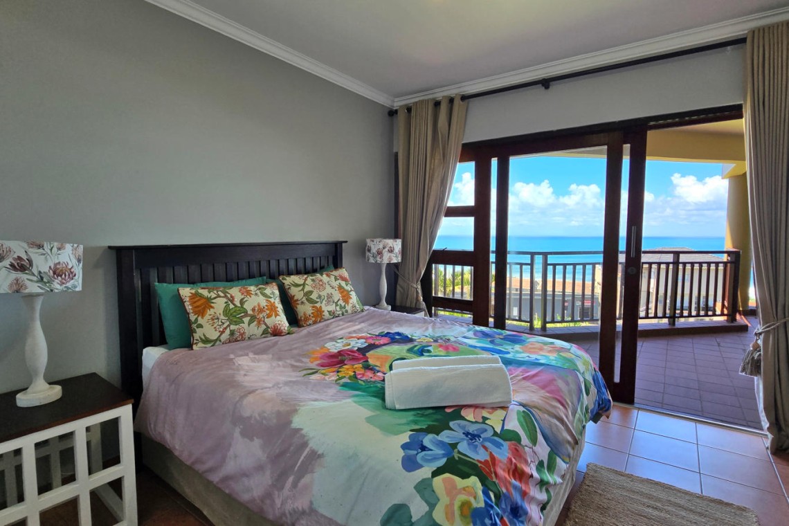 Stay at Kuta Beach 17 Ramsgate, a stunning 4-bedroom, 8-sleeper self-catering holiday apartment KZN with sea views, Wi-Fi, pool, and Smart TV.