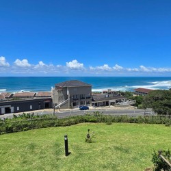 Stay at Kuta Beach 17 Ramsgate, a stunning 4-bedroom, 8-sleeper self-catering holiday apartment KZN with sea views, Wi-Fi, pool, and Smart TV.