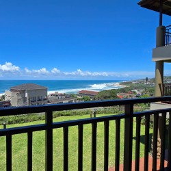 Stay at Kuta Beach 17 Ramsgate, a stunning 4-bedroom, 8-sleeper self-catering holiday apartment KZN with sea views, Wi-Fi, pool, and Smart TV.