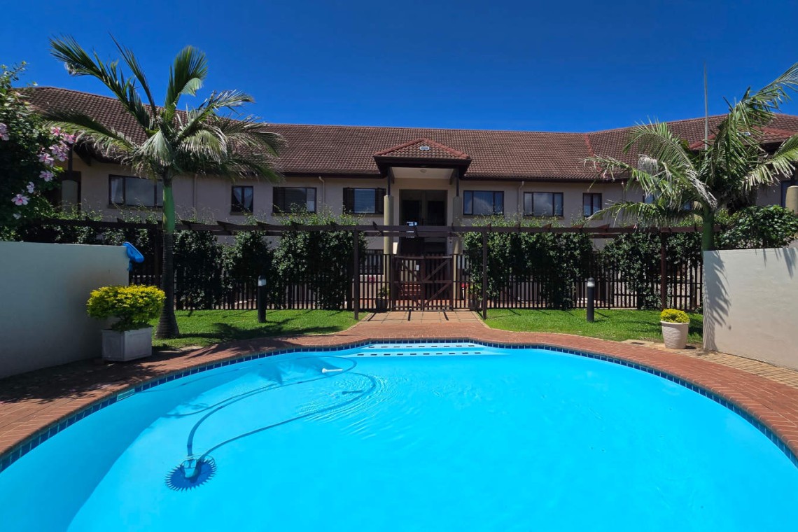 Stay at Kuta Beach 17 Ramsgate, a stunning 4-bedroom, 8-sleeper self-catering holiday apartment KZN with sea views, Wi-Fi, pool, and Smart TV.