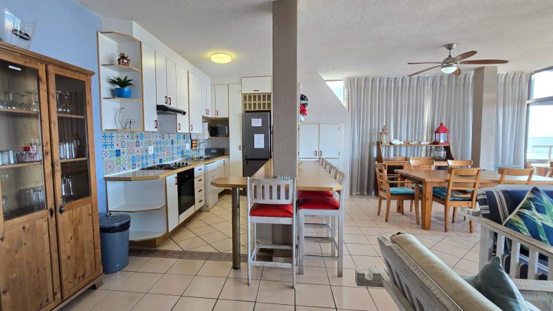 The open plan kitchen and breakfast counter at C - Front 11 a self-catering holiday penthouse on Manaba sea front with an 180 degree sea view.