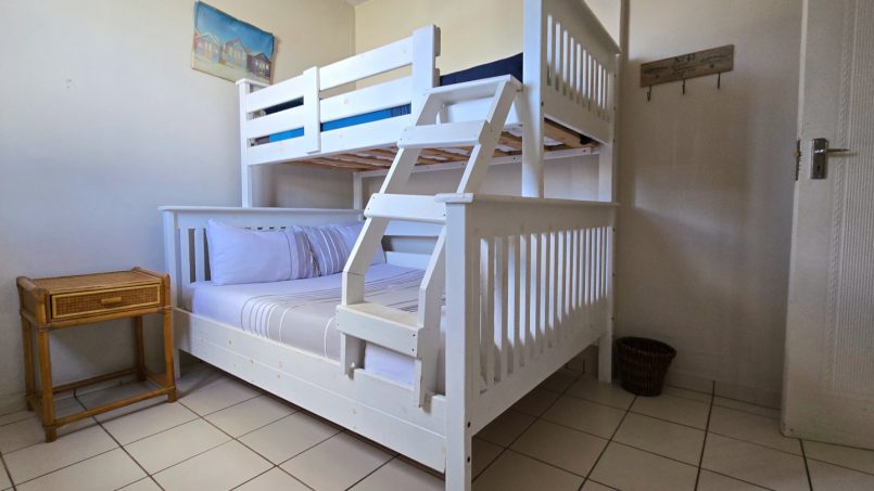 The third bedroom at C - Front 11, a self-catering holiday penthouse on Manaba sea front with an 180 degree sea view that sleeps 7 and is walking distance to Lucien Blue Flag Beach.