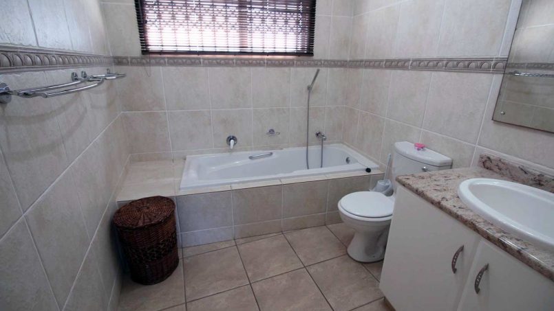 Guests bathroom with a bath and a shower at Le Touessrok 32 Ramsgate.
