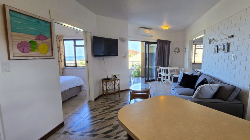 Open plan living at Southcoast Seaview @ No 3 Bonamic – open-plan lounge and dining with sea view