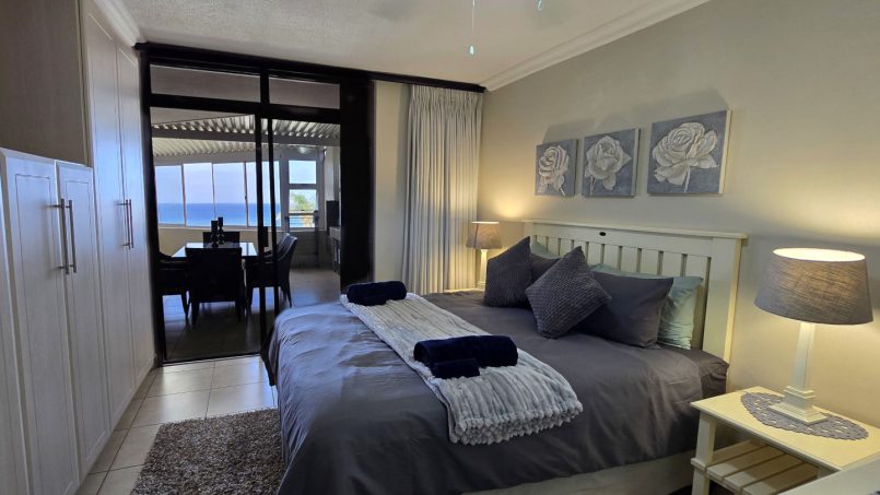 Queen bed main bedroom of Chardonnay Cabanas 5 with ensuite and sliding doors to patio