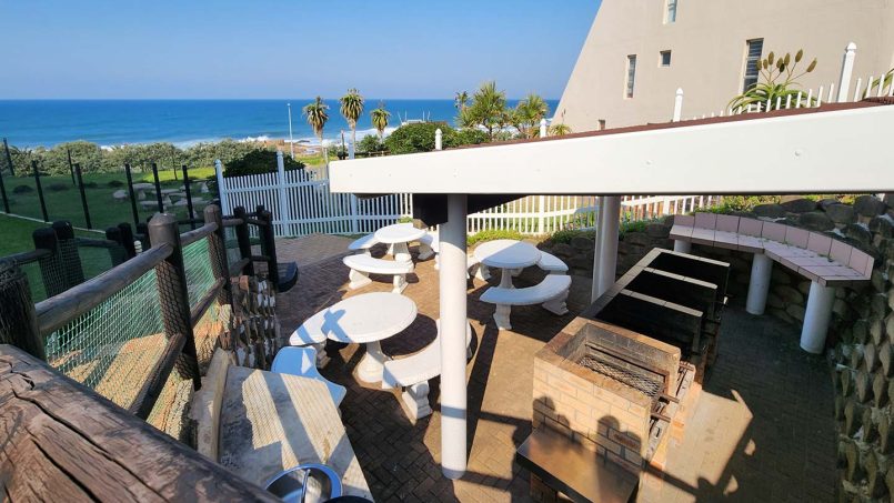 The Communal family braai area at Don Juan 2, Margate, with swimming pool on the beachfront