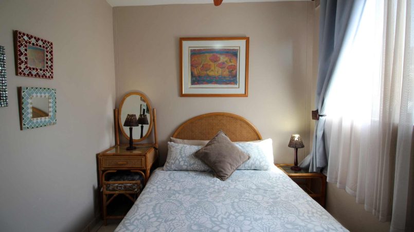 Second bedroom with twin beds for family-friendly accommodation in Manaba Beachsleeps 7 and is walking distance to Lucien Blue Flag Beach.