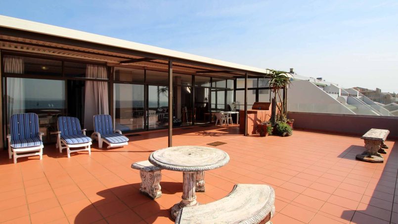 Spacious patio with outdoor seating and panoramic sea view at C Front 11 Manaba Beach penthouse