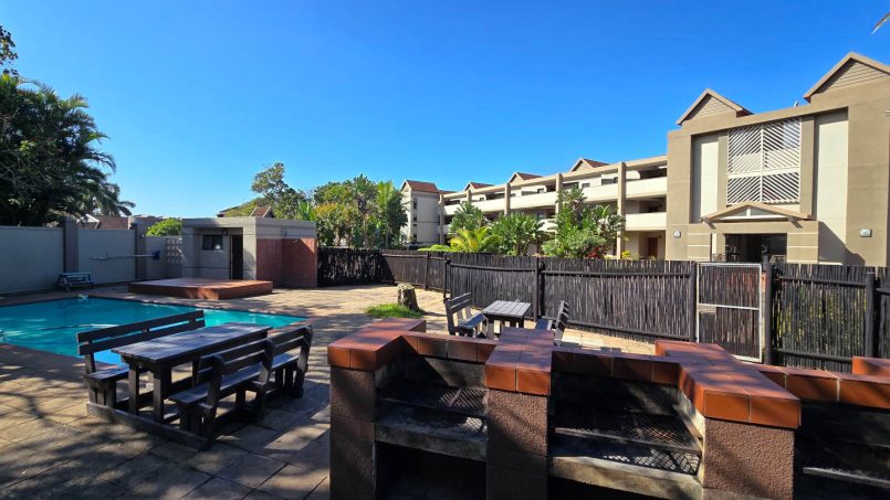 Braai with the family on the charcoal braais next to the swimming pool at Portofino 15.