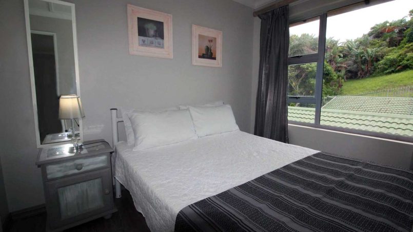 Family bedroom with a double bed at Ramsgate Palms 76 self-catering apartment