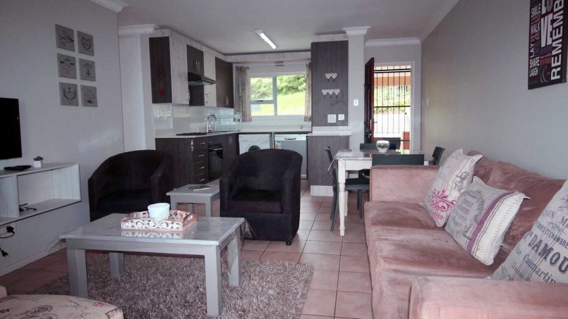 The living room at Ramsgate Palms 76 provides comfortable seating with a bright, airy layout and stunning sea views, just steps away from Ramsgate Main Beach.