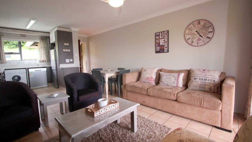 The living room at Ramsgate Palms 76 provides comfortable seating with a bright, airy layout and stunning sea views, just steps away from Ramsgate Main Beach.