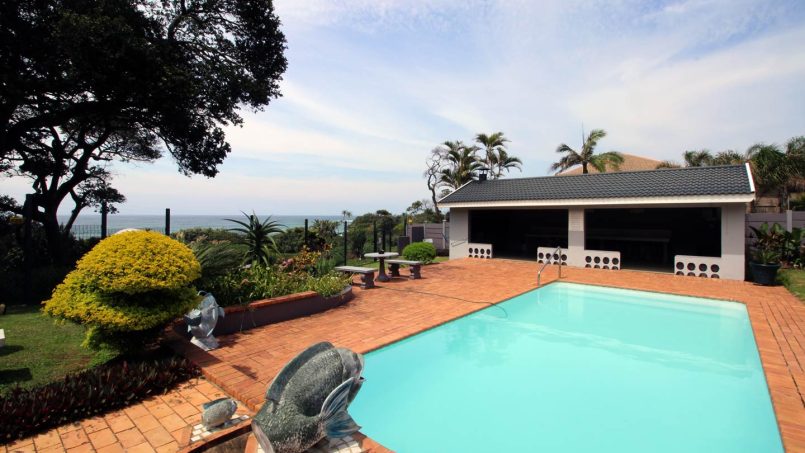 Enjoy your self-catering holiday in **Shelly Palms 6**—a perfect **beach holiday in Shelly Beach** where you can **walk onto the beach** and admire a breathtaking **sea view over the swimming pool**. Ideal for a **family holiday in shelly beach**, this coastal retreat captures the essence of a true seaside escape.