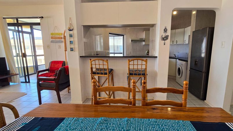 Dining and kitchen at Margate Sun 11 holiday apartment with breakfast counter close to Margate Beach