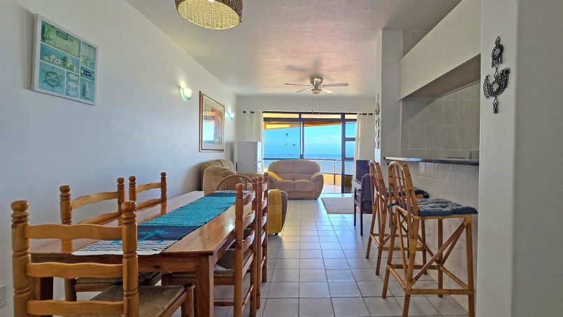 Comfortable lounge at Margate Sun 11 with sliding doors opening to a balcony and sea views over Margate