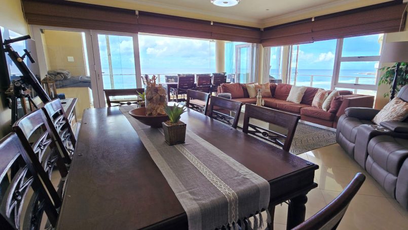 Enjoy your meals at the dining table while you gaze out sea at Lucien Sands 501.